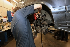 Mechanic working on a vehicle at Amtech Auto Care Inc. - image #4
