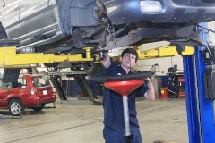 Mechanic working on a vehicle at Amtech Auto Care Inc. - image #9